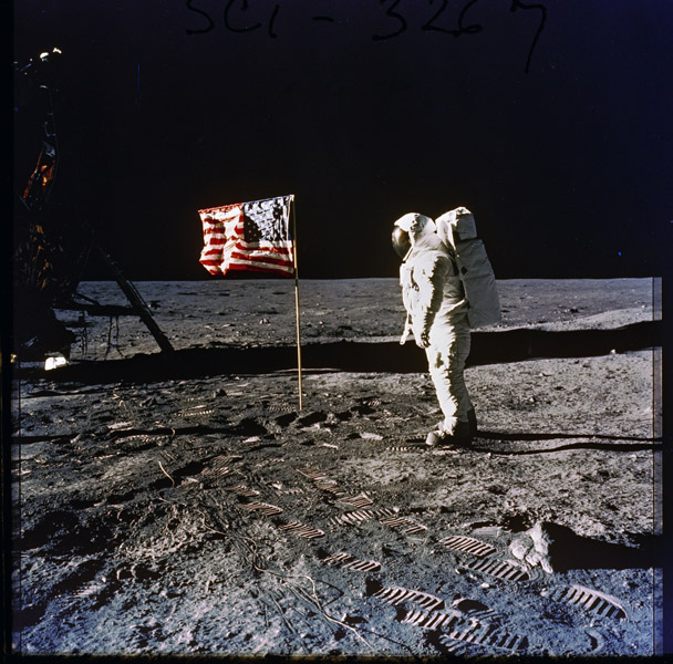 Astronaut Edwin E. (Buzz) Aldrin, Jr. Posing on the Moon Next to the U.S. Flag