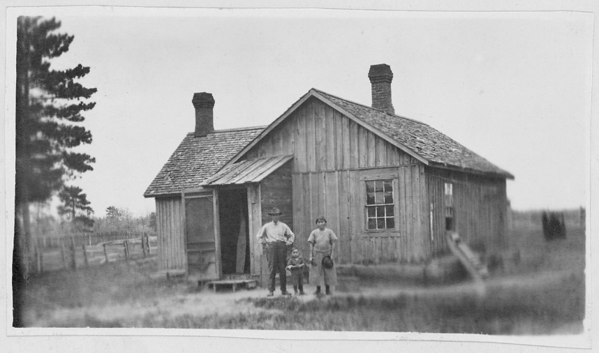 People standing in front of a house